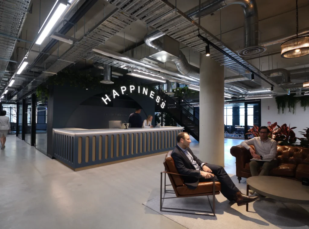 Reception area at CreativeCubes.Co highlighting the Happiness Team supporting Sydney’s coworking growth