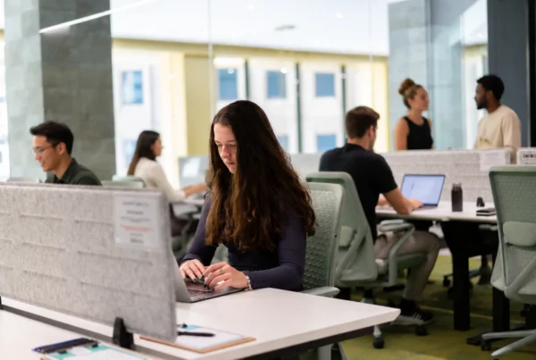 Australian SME professionals working in a modern coworking space