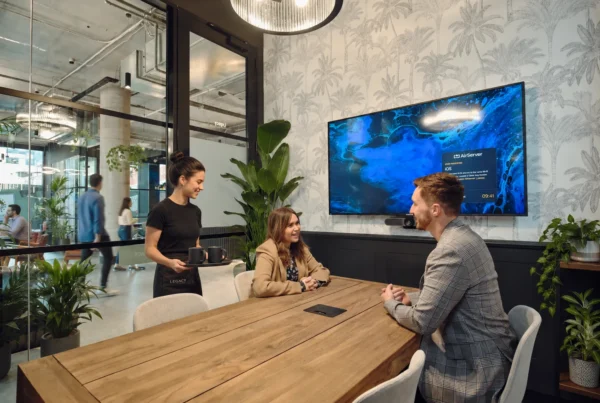 Small business team collaborating inside a modern Cubes.Co coworking space in Australia with flexible work areas and meeting rooms
