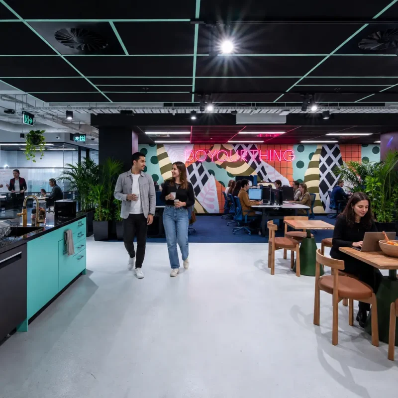 Growing business team collaborating in flexible office space at CreativeCubes.Co