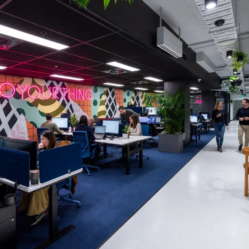 Growing business team planning its next move in flexible office space at CreativeCubes.Co