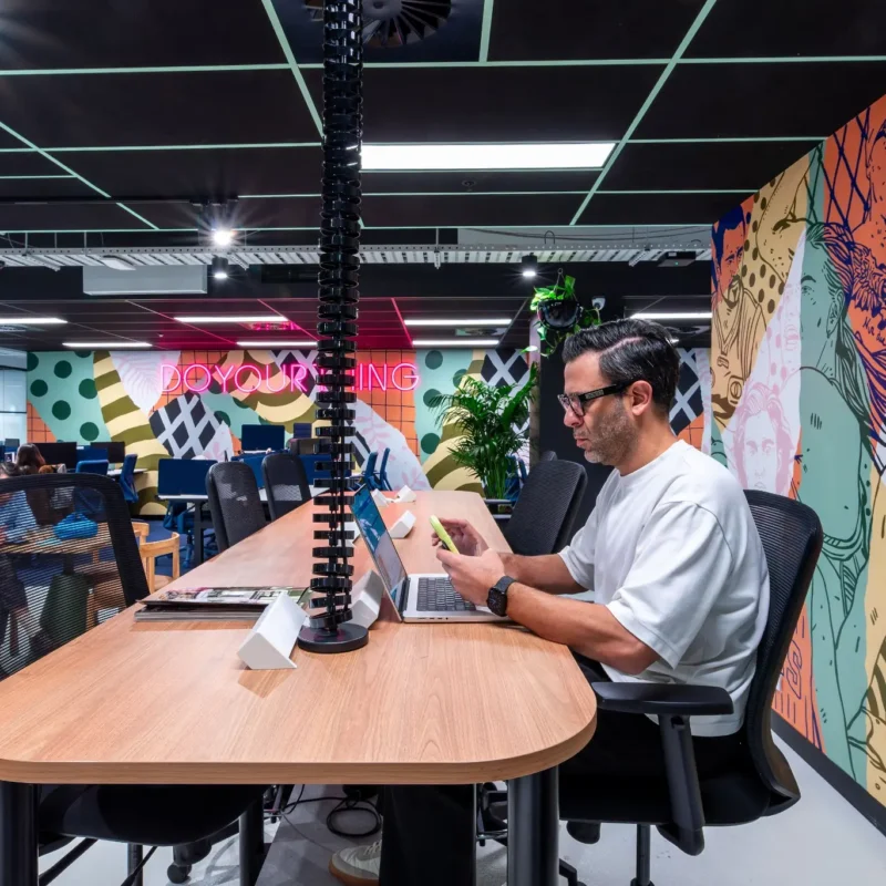 Small business team collaborating in a flexible coworking space at CreativeCubes.Co