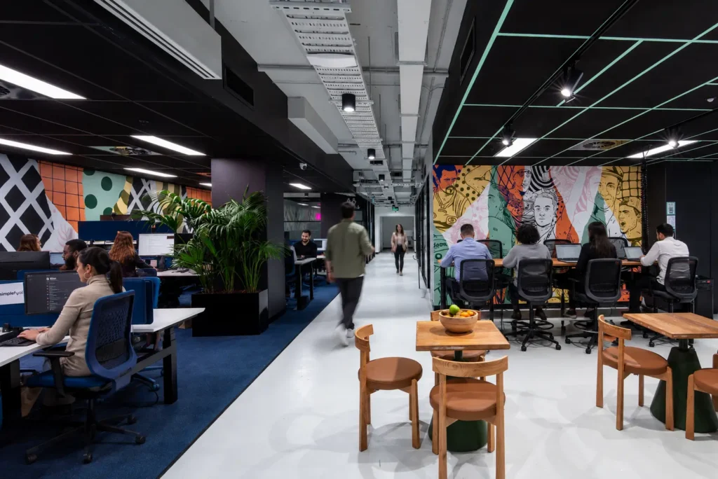 Professional team collaborating in a flexible workspace designed to improve employee engagement
