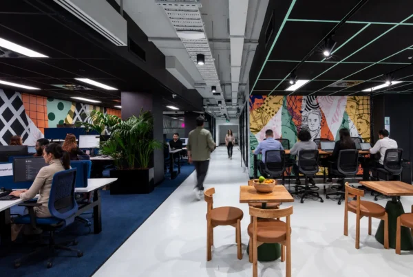 Professional team collaborating in a flexible workspace designed to improve employee engagement