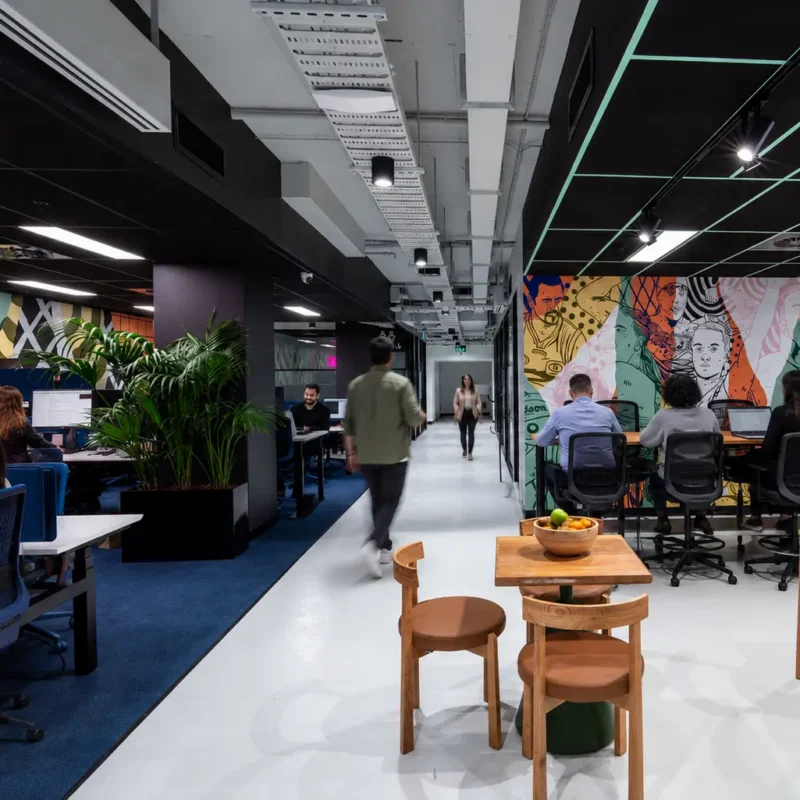 Professional team collaborating in a flexible workspace designed to improve employee engagement