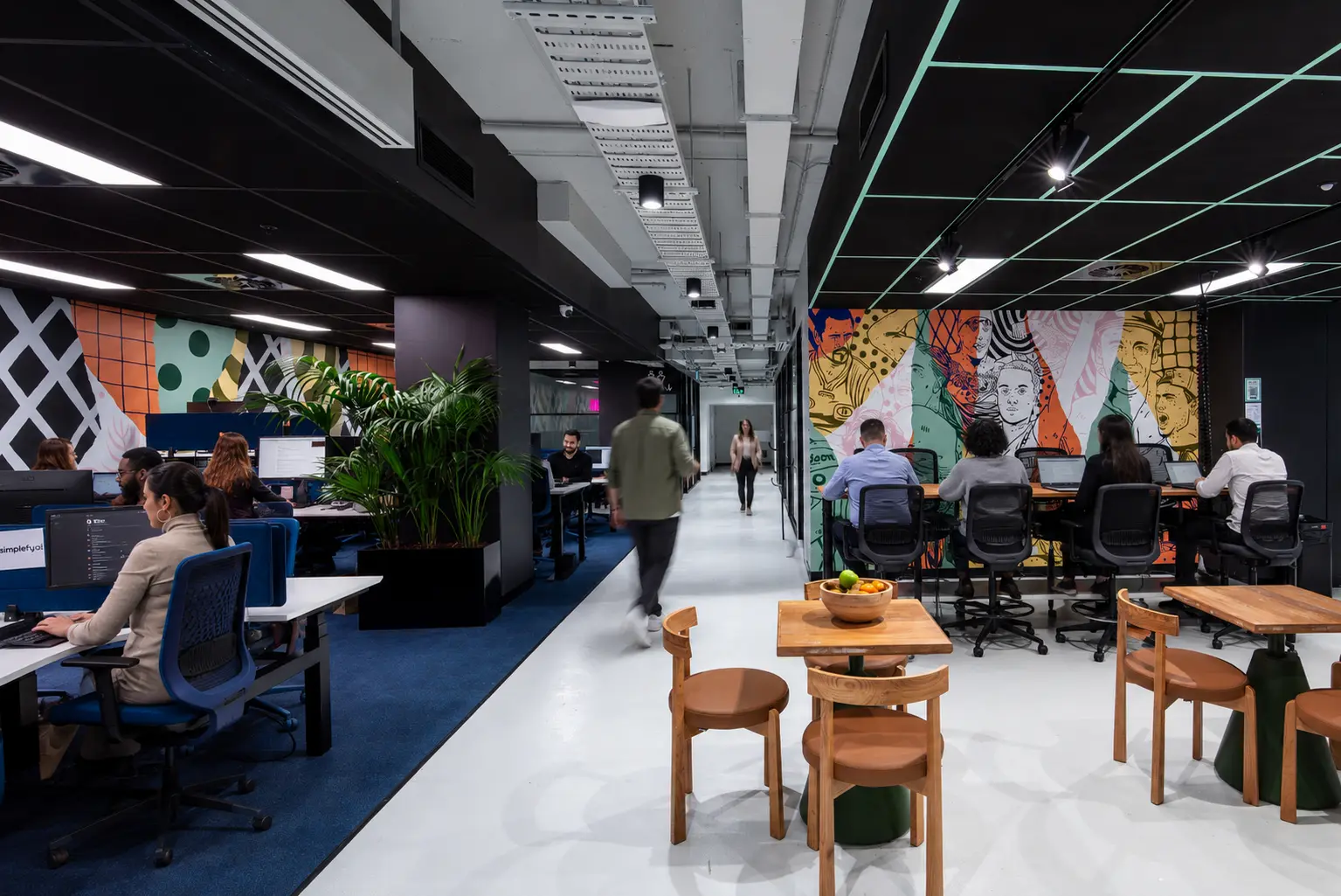 Professional team collaborating in a flexible workspace designed to improve employee engagement