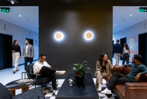 Professionals collaborating in a flexible office designed to improve employee engagement and motivation