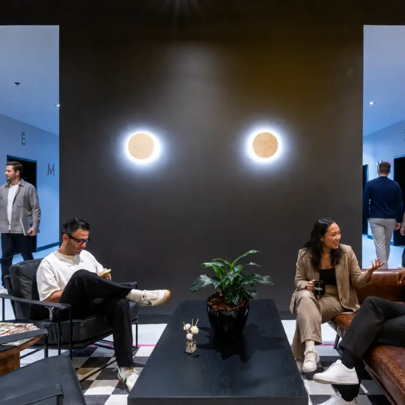 Professionals collaborating in a flexible office designed to improve employee engagement and motivation
