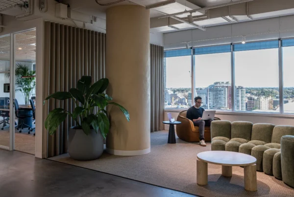 Small professional team working inside a serviced private office with meeting rooms and reception services.