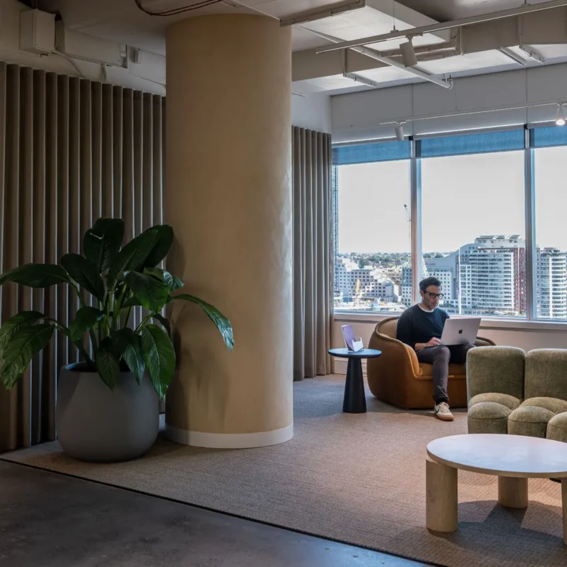 Small professional team working inside a serviced private office with meeting rooms and reception services.