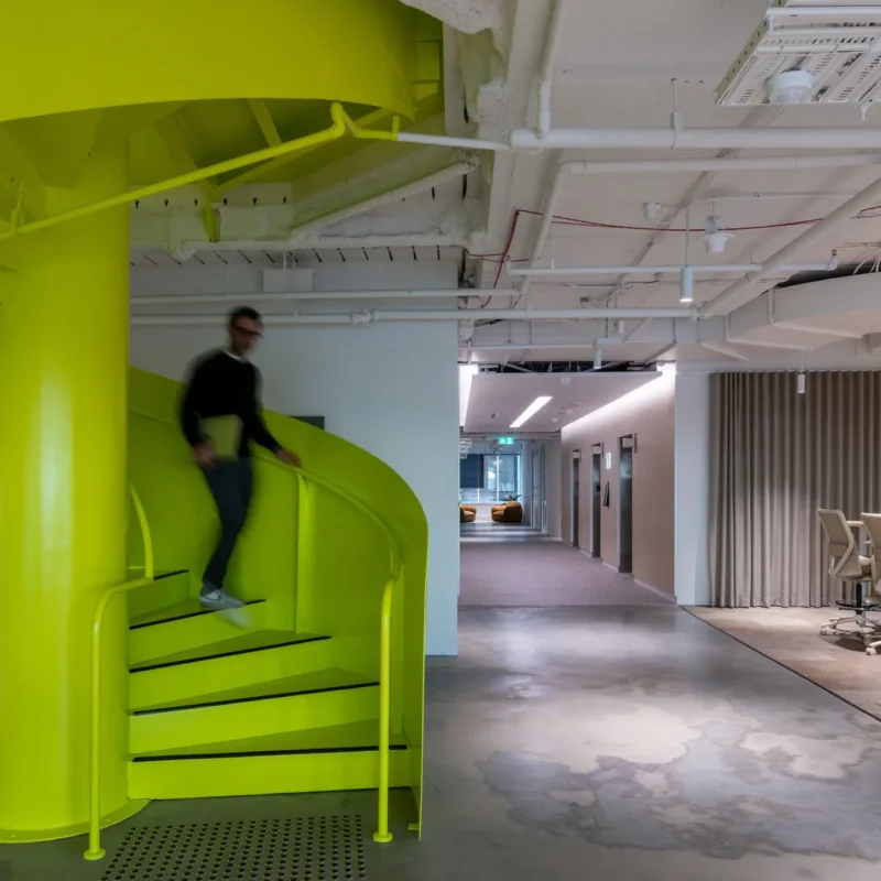 Australian SME leaders comparing coworking vs long-term lease costs in a modern flexible office space.